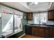 Kitchen with wood cabinets and granite countertops at 2416 W Caribbean Ln # 1, Phoenix, AZ 85023