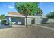 Tan stucco exterior with a gated entrance at 2416 W Caribbean Ln # 1, Phoenix, AZ 85023