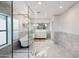 Large bathroom with a soaking tub, walk-in shower, and marble floors at 3044 Ironwood Rd, Carefree, AZ 85377