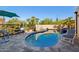 Inviting kidney-shaped pool with spa and patio seating area at 3044 Ironwood Rd, Carefree, AZ 85377