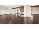 Open living room featuring hardwood floors and a stone fireplace at 3044 Ironwood Rd, Carefree, AZ 85377