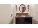 Stylish bathroom with dark wood vanity and marble countertop at 3044 Ironwood Rd, Carefree, AZ 85377