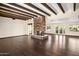 Spacious living room with hardwood floors and stone fireplace at 3044 Ironwood Rd, Carefree, AZ 85377