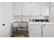 Bright laundry room, featuring stainless steel sink and modern washer/dryer at 3044 Ironwood Rd, Carefree, AZ 85377