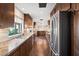Long kitchen with granite countertops, stainless steel appliances, and wood cabinets at 3044 Ironwood Rd, Carefree, AZ 85377