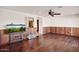 Gathering room with hardwood floors, wood paneling, and aquarium at 3044 Ironwood Rd, Carefree, AZ 85377