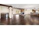 Spacious living room with hardwood floors, stone fireplace, and high ceilings at 3044 Ironwood Rd, Carefree, AZ 85377