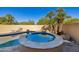 Round spa nestled in a private corner of the backyard at 3044 Ironwood Rd, Carefree, AZ 85377