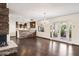 Elegant dining room with hardwood floors, chandelier, and French doors at 3044 Ironwood Rd, Carefree, AZ 85377