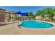 Community pool with a blue shade sail and lounge chairs at 21931 N 30Th St, Phoenix, AZ 85050