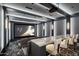 Luxury home theater with large screen and comfortable seating at 20958 N 112Th St, Scottsdale, AZ 85255