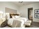 Bright bedroom with plush bedding and ensuite bathroom access at 20958 N 112Th St, Scottsdale, AZ 85255