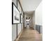 Bright hallway with hardwood floors and framed artwork at 20958 N 112Th St, Scottsdale, AZ 85255