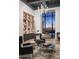 Spacious library features built-in shelving, comfortable seating, and panoramic windows at 20958 N 112Th St, Scottsdale, AZ 85255