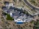 Aerial view of a luxurious home with a large pool and landscaping at 20958 N 112Th St, Scottsdale, AZ 85255