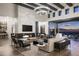Spacious living area features a marble fireplace, high ceilings, and large windows at 20958 N 112Th St, Scottsdale, AZ 85255