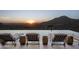 Luxury pool with mountain and sunset view; multiple lounge chairs at 20958 N 112Th St, Scottsdale, AZ 85255