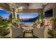 Covered patio with fireplace and stunning sunset views at 20958 N 112Th St, Scottsdale, AZ 85255