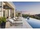 Relaxing poolside patio with lounge chairs and stunning sunset views at 20958 N 112Th St, Scottsdale, AZ 85255