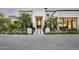 Stunning curb appeal with a grand entrance, landscaped grounds, and paved driveway at 20958 N 112Th St, Scottsdale, AZ 85255