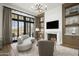 Relaxing sitting area includes a fireplace, built-in shelving and views at 20958 N 112Th St, Scottsdale, AZ 85255