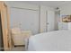 Relaxing bedroom with a queen bed, chair, and built-in closet at 4620 N 68Th St # 136, Scottsdale, AZ 85251