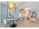 Open living and dining area featuring a stylish workspace and comfortable seating at 4620 N 68Th St # 136, Scottsdale, AZ 85251