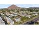 Aerial view of apartment complex with a pool and mountain backdrop at 4620 N 68Th St # 136, Scottsdale, AZ 85251