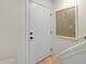 Bright entryway with a white door and modern wall art at 4620 N 68Th St # 136, Scottsdale, AZ 85251