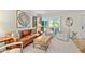 Living room with leather sofa, armchairs, and a wooden coffee table at 4620 N 68Th St # 136, Scottsdale, AZ 85251
