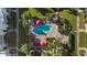 Aerial view of a community pool with surrounding lounge chairs and umbrellas at 4620 N 68Th St # 136, Scottsdale, AZ 85251