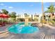 Community pool with lounge chairs and umbrella at 4620 N 68Th St # 136, Scottsdale, AZ 85251