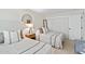 Bright bedroom with two twin beds, nightstand, and ample closet space at 4620 N 68Th St # 136, Scottsdale, AZ 85251
