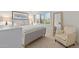 Cozy bedroom featuring a queen bed, chair, and large window with light at 4620 N 68Th St # 136, Scottsdale, AZ 85251