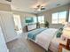 Large bedroom with plush carpet, a ceiling fan, and ample natural light at 1716 W Lucky Ln, Queen Creek, AZ 85144