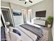 Spacious bedroom with ceiling fan, plush carpet, and an ensuite bathroom at 1716 W Lucky Ln, Queen Creek, AZ 85144