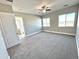 Spacious bedroom with large windows and ceiling fan at 1716 W Lucky Ln, Queen Creek, AZ 85144