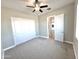 Bright bedroom with ceiling fan and double door closet at 1716 W Lucky Ln, Queen Creek, AZ 85144