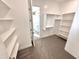 Walk-in closet with built-in shelves and hanging space at 1716 W Lucky Ln, Queen Creek, AZ 85144