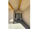 Inviting entryway with wood beam accents and a modern door at 1716 W Lucky Ln, Queen Creek, AZ 85144