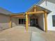 Front exterior showcasing a covered porch with wood beams at 1716 W Lucky Ln, Queen Creek, AZ 85144