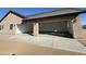 Three-car garage with attached exterior view, offering ample parking at 1716 W Lucky Ln, Queen Creek, AZ 85144