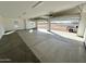 Spacious three-car garage with open doors, offering ample storage at 1716 W Lucky Ln, Queen Creek, AZ 85144