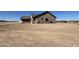 Side view of house showcasing desert landscaping and neutral color scheme at 1716 W Lucky Ln, Queen Creek, AZ 85144