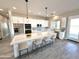 Modern kitchen with white cabinets, stainless steel appliances, and a large island at 1716 W Lucky Ln, Queen Creek, AZ 85144
