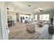 Open floor plan with living area, dining space, and a view of the kitchen at 1716 W Lucky Ln, Queen Creek, AZ 85144