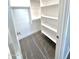 Large walk-in closet with shelves and hanging rods at 1716 W Lucky Ln, Queen Creek, AZ 85144