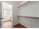 Spacious walk-in closet with ample shelving and hanging rods at 2046 S Warren --, Mesa, AZ 85209