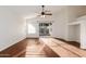 Bright living room featuring wood floors, sliding glass doors, and a view of the backyard at 2046 S Warren --, Mesa, AZ 85209