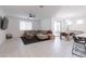 Open living room and dining area with tile floors at 19922 W Exeter Blvd, Litchfield Park, AZ 85340